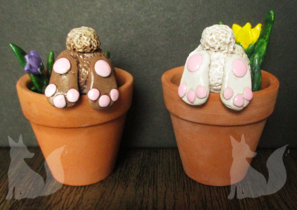 Clay bunnies in pots